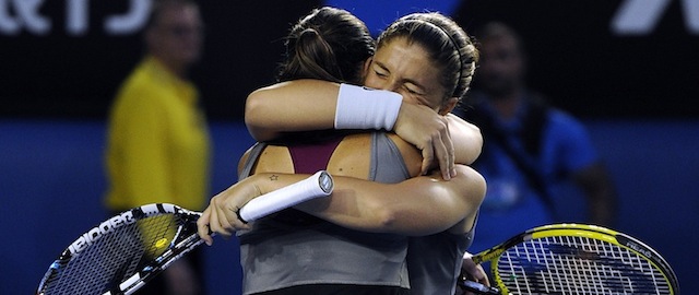 Italy's Sara Errani, right, and Roberta Vinci, left, celebrate after defeating Russia's Ekaterina Makarova and Elena Vesnina in their women’s doubles final at the Australian Open tennis championship in Melbourne, Australia, Friday, Jan. 24, 2014.(AP Photo/Andrew Brownbill)