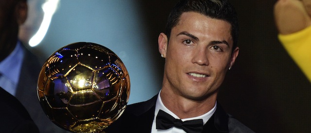 Cristiano Ronaldo of Portugal is awarded the prize for the FIFA Men's soccer player of the year 2013 at the FIFA Ballon d'Or 2013 gala at the Kongresshaus in Zurich, Switzerland, Monday, Jan. 13, 2014. (AP Photo/Keystone, Steffen Schmidt)