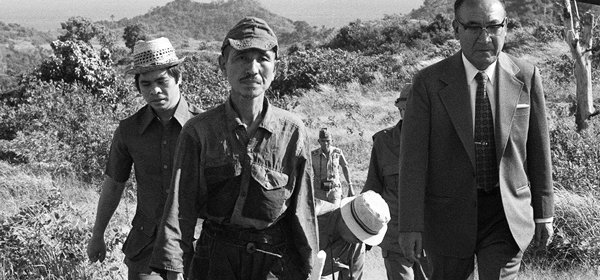 This picture taken on March 11, 1974 shows former Japanese imperial army soldier Hiroo Onoda (2nd L) walking from the jungle where he had hidden since World War II, on Lubang island in the Philippines. Onoda, who hid in the Philippine jungle for three decades because he did not believe World War II was over, has died in Tokyo on January 17, 2014, at the age of 91. The former soldier waged a guerilla campaign in Lubang Island near Luzon until he was finally persuaded in 1974 that peace had broken out. JAPAN OUT AFP PHOTO / JIJI PRESS (Photo credit should read JIJI PRESS/AFP/Getty Images)