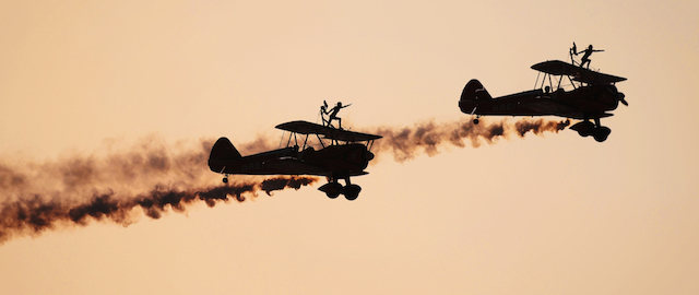 Breitling Wingwalkers display team perform during the opening of the Bahrain International Airshow 2014, in Sakhir, south of the capital Manama, on January 16, 2014. AFP PHOTO/MOHAMMED AL-SHAIKH (Photo credit should read MOHAMMED AL-SHAIKH/AFP/Getty Images)