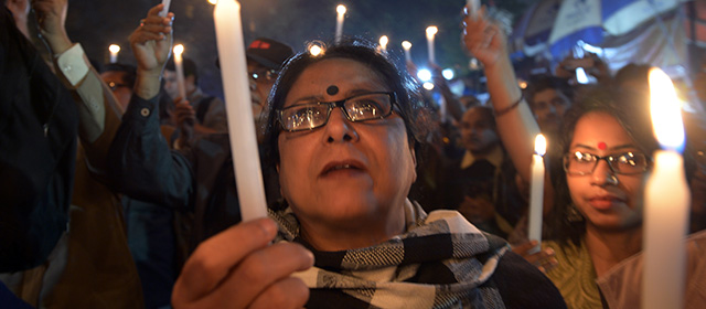 Indian activists hold candles as they participate in a mass meeting to protest against the gangrape and murder of a teenager in Kolkata on January 2, 2014. An Indian teenager near the eastern city of Kolkata has been gangraped twice and then burned alive, police said, sparking protests after she died of her injuries.The 16-year-old was assaulted first on October 26, 2013 and then again the day after by a group of more than six men near her family's home in Madhyagram town, about 25 kilometres (15 miles) north of Kolkata. After being set on fire on December 23, she died in a state-run hospital on December 31. AFP PHOTO/Dibyangshu SARKAR (Photo credit should read DIBYANGSHU SARKAR/AFP/Getty Images)