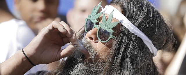 DENVER, CO - APRIL 20: An estimated 10,000 people are expected to gather in Civic Center Park in Denver, Colorado on April 20, 2012 to celebrate the state's Medicinal Marijuana laws and collectively light up at 4:20pm. On Nov. 6, Colorado may become the first state to legalize marijuana with the passing of Amendment 64, a controversial ballot initiative that would permit up to 1 ounce of possession for those 21 and older. (Photo by Marc Piscotty/Getty Images) *** Local Caption *** Person