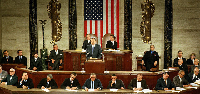 U.S. President Richard M. Nixon is shown Jan. 22, 1971 delivering his State of the Union address to Congress. Seated behind the president are U.S. Vice President Spiro Agnew, left, and speaker of the house Carl Albert. (AP Photo)