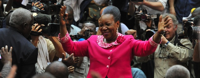 The mayor of Bangui, Catherine Samba-Panza, waves to National Transitional Council (CNT) members after being elected interim president of the Central African Republic on January 20, 2014, in Bangui. Samba-Panza was elected in a second-round vote by the transitional parliament, securing 75 votes against 53 for Desire Kolingba, the son of a former Central African president. AFP PHOTO / ISSOUF SANOGO (Photo credit should read ISSOUF SANOGO/AFP/Getty Images)