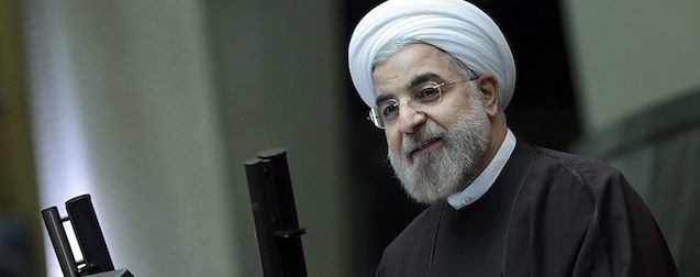 In this photo released by the official website of the office of the Iranian Presidency, Iran's President Hassan Rouhani speaks about next year's budget bill in an open session of parliament in Tehran, Iran, Sunday, Dec. 8, 2013. Rouhani said Sunday that last month's nuclear deal with world powers has already boosted the country's economy, as he continues a push to convince skeptics of the benefits brought by the pact's partial sanctions relief. The proposed budget covers Iran's fiscal year that starts March 21, 2014. (AP Photo/Presidency Office, Rouzbeh Jadidoleslam)