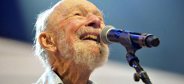Pete Seeger performs on stage during the Farm Aid 2013 concert at Saratoga Performing Arts Center in Saratoga Springs, N.Y., Saturday, Sept. 21, 2013. (AP Photo/Hans Pennink)