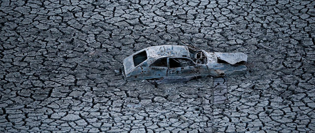 SAN JOSE, CA - JANUARY 28: A car sits in dried and cracked earth of what was the bottom of the Almaden Reservoir on January 28, 2014 in San Jose, California. Now in its third straight year of drought conditions, California is experiencing its driest year on record, dating back 119 years, and reservoirs throughout the state have low water levels. Santa Clara County reservoirs are at 3 percent of capacity or lower. California Gov. Jerry Brown officially declared a drought emergency to speed up assistance to local governments, streamline water transfers and potentially ease environmental protection requirements for dam releases. (Photo by Justin Sullivan/Getty Images)
