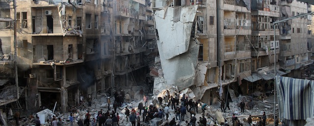 Syrians search for survivors amidst the rubble following an airstrike in the Shaar neighborhood of Aleppo on December 17, 2013. Two children were among at least 13 people killed in new air strikes on a rebel-held district of Syria's main northern city of Aleppo, the Syrian Observatory for Human Rights said. AFP PHOTO/MOHAMMED AL-KHATIEB (Photo credit should read MOHAMMED AL-KHATIEB/AFP/Getty Images)