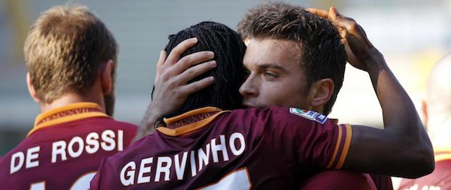 AS Roma's forward Adem Ljajic, center, of Serbia, is hugged by his teammate Gervinho, of Ivory Coast, center, after he scored during a Serie A soccer match against Hellas Verona at the Bentegodi stadium in Verona, Italy, Sunday, Jan. 26, 2014. (AP Photo/Felice Calabro')