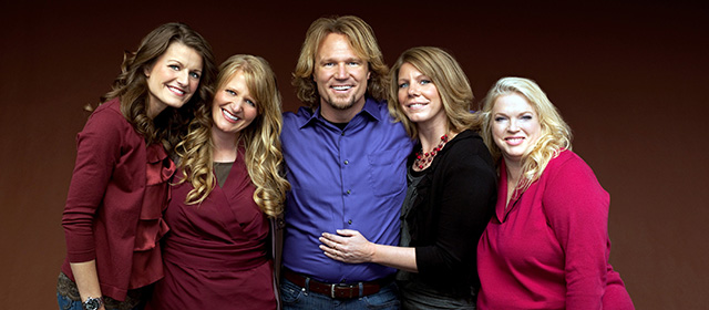 FILE - In this file publicity photo provided by TLC, Kody Brown, center, poses with his wives, from left, Robyn, Christine, Meri and Janelle, in a promotional photo for the reality series, "Sister Wives," which aired in March, 2011. When the polygamous family learned in December 2013 that a federal judge in Utah struck down key parts of the state's polygamy laws, Brown and his four wives said they cried and felt deeply emotional. The family says they are grateful for the ruling, but said winning the lawsuit they brought against Utah in July 2011 doesn’t ease the pain caused by the significant personal sacrifices they made when they fled the state for Las Vegas under the threat of prosecution. (AP Photo/TLC, George Lange, File)