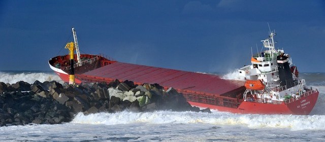 A picture taken on February 5, 2014 shows a Spanish cargo ship ''Luno'' which slammed into a dyke and split in two, injuring at least one sailor and raising concerns of a fuel leak, in Anglet, near the French port of Bayonne. The prefecture for the Pyrenees-Atlantiques region said efforts were underway to recover the sailors by helicopter but the rescue operation was being hampered by winds of up to 110 kilometres per hour (70 miles per hour). Officials said a fuel leak had been detected and an emergency plan known as Polmar had been activated to deal with maritime pollution. AFP PHOTO/ KEPA ETCHANDY (Photo credit should read KEPA ETCHANDY/AFP/Getty Images)