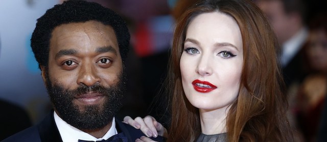 British actor Chiwetel Ejiofor (L) arrives on the red carpet for the BAFTA British Academy Film Awards at the Royal Opera House in London on February 16, 2014. AFP PHOTO / ANDREW COWIE (Photo credit should read ANDREW COWIE/AFP/Getty Images)