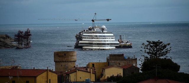 A view of the wreck of Italy's Costa Concordia cruise ship in the harbour of the Giglio Port on February 26 , 2014. Residents of Italy's Giglio Island reacted with mixed emotions today to the first return visit by captain Francesco Schettino since a tragedy in which 32 people on his Costa Concordia cruise ship died. AFP PHOTO / FILIPPO MONTEFORTE (Photo credit should read FILIPPO MONTEFORTE/AFP/Getty Images)