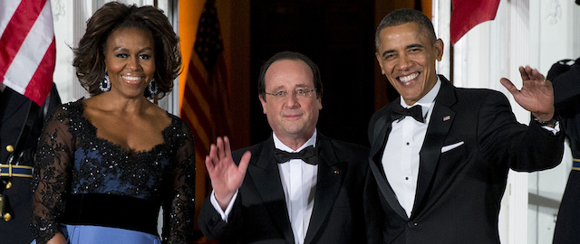 Michelle Obama, François Hollande e Barack Obama. 
(AP Photo/ Evan Vucci)
