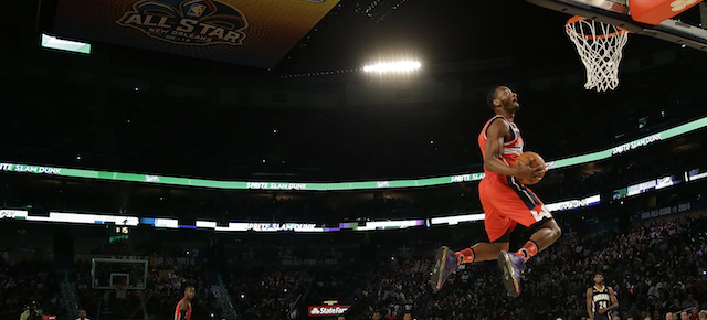 John Wall of the Washington Capitals participates in the slam dunk contest during the skills competition at the NBA All Star basketball game, Saturday, Feb. 15, 2014, in New Orleans. (AP Photo/Gerald Herbert)