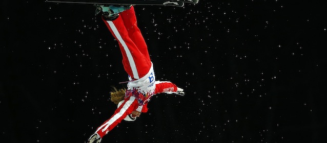 Switzerland's Tanja Schaerer jumps during a freestyle skiing aerials training session at the Rosa Khutor Extreme Park, at the 2014 Winter Olympics, Thursday, Feb. 13, 2014, in Krasnaya Polyana, Russia. (AP Photo/Sergei Grits)