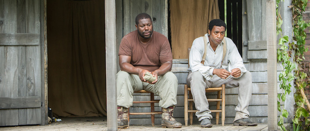 This image released by Fox Searchlight shows director Steve McQueen, left, and actor Chiwetel Ejiofor during the filming of "12 Years A Slave." McQueen was nominated for a Golden Globe for best director for the film on Thursday, Dec. 12, 2013. The 71st annual Golden Globes will air on Sunday, Jan. 12. (AP Photo/Fox Searchlight, Jaap Buitendijk)