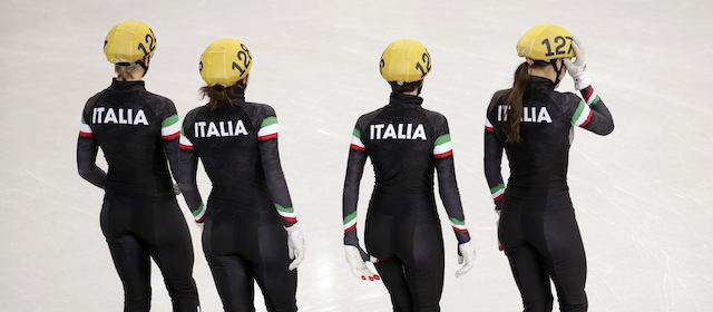 From left, Arianna Fontana of Italy, Elena Viviani of Italy, Lucia Peretti of Italy and Martina Valcepina of Italy take to the ice before competing in the women's 3000m short track speedskating relay final at the Iceberg Skating Palace during the 2014 Winter Olympics, Tuesday, Feb. 18, 2014, in Sochi, Russia. (AP Photo/Bernat Armangue)