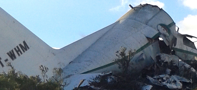 An Algerian military transport plane is pictured after it slammed into a mountain in the country’s rugged eastern region, Tuesday, Feb. 11, 2014. A civil defense official said 102 people on board were killed but one person managed to survive. The U.S.-built C-130 Hercules transport crashed about noon near the town of Ain Kercha, 50 kilometers (30 miles) southeast of Constantine, the main city in eastern Algeria. ( AP Photo/ Mohamed Ali)