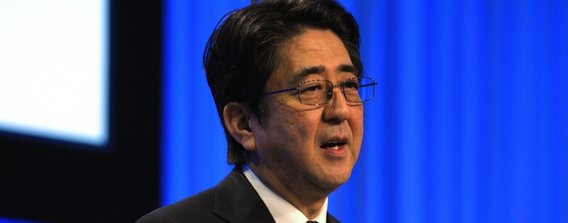 Japanese Prime Minister Shinzo Abe delivers his special address during the opening session of the World Economic Forum in Davos on January 22, 2014. Abe, currently embroiled in a diplomatic spat with China, took centre stage at Davos as 2,500 political and business leaders kicked off their annual brainstorming blitz. AFP PHOTO/ERIC PIERMONT (Photo credit should read ERIC PIERMONT/AFP/Getty Images)