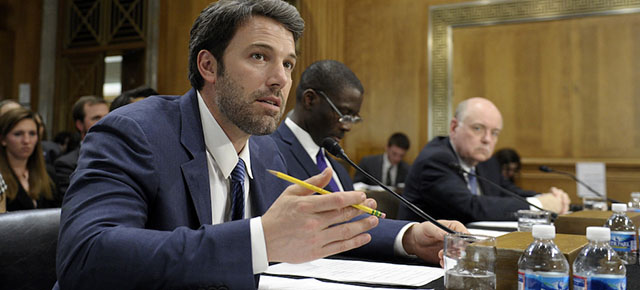 Actor and Eastern Congo Initiative Founder Ben Affleck, left, testifies on Capitol Hill in Washington, Wednesday, Feb. 26, 2014, before the Senate Foreign Relations Committee hearing on the Congo. Raymond Gilpin, Academic Dean of the Africa Center for Strategic Studies at the National Defense University, center, and former U.S. Ambassador to the Democratic Republic of Congo Roger Meece, right, join Affleck at the witness table. (AP Photo/Susan Walsh)