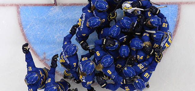 Sweden's players celebrate after winning the Women's Ice Hockey Group B match Germany vs Sweden at the Shayba Arena during the Sochi Winter Olympics on February 11, 2014. Sweden won 0-4. AFP PHOTO / JONATHAN NACKSTRAND (Photo credit should read JONATHAN NACKSTRAND/AFP/Getty Images)