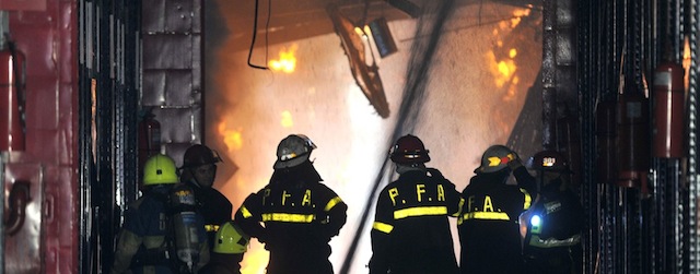 Firefighters work to extinguish a fire at the Iron Mountain warehouse in Buenos Aires, Argentina, Wednesday, Feb. 5, 2014. Seven first-responders were killed in the fire that destroyed an archive of bank documents, according to authorities. (AP Photo/Telam, Daniel Dabove)