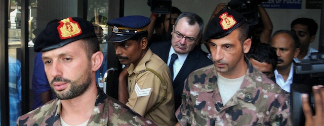 Italian marines Salvatore Girone, left, and Massimiliano Latorre, right, come out of the office of the police commissioner in Kochi, India, Friday, Jan. 4, 2013. The marines returned to Kochi Friday after visiting their homes for Christmas celebrations in Italy. The two were detained in India after they mistook two fishermen for pirates and fatally shot them. (AP Photo) INDIA OUT