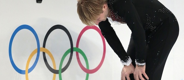 Evgeni Plushenko of Russia skates on the ice prior to pulling out of the men's short program figure skating competition due to illness at the Iceberg Skating Palace during the 2014 Winter Olympics, Thursday, Feb. 13, 2014, in Sochi, Russia. (AP Photo/Ivan Sekretarev)