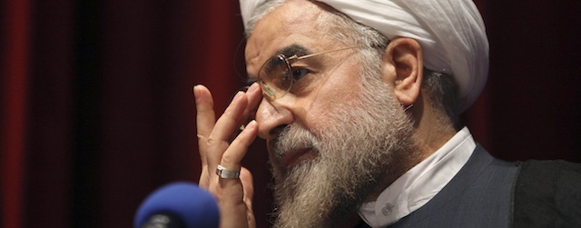 Iran's former nuclear negotiator, Hasan Rohani, a potential front-runner in presidential race, adjusts his glasses during a campaign rally in Tehran, Iran, Thursday, April 11, 2013. Rohani suggested he would seek better relations with the West in efforts to lessen international showdowns. (AP Photo/Vahid Salemi)