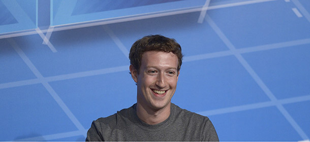 Mark Zuckerberg Chairman and CEO of Facebook pauses, during a conference at the Mobile World Congress, the world's largest mobile phone trade show in Barcelona, Spain, Monday, Feb. 24, 2014. Expected highlights include major product launches from Samsung and other phone makers, along with a keynote address by Facebook founder and chief executive Mark Zuckerberg. (AP Photo/Manu Fernandez)