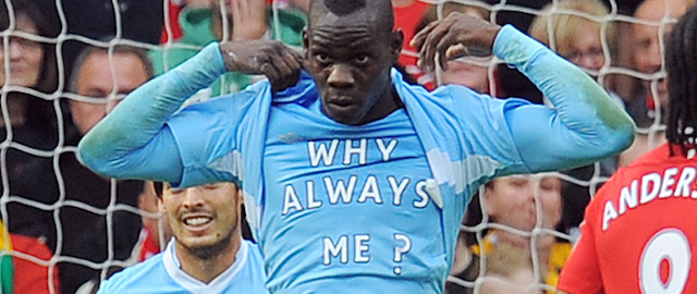 Manchester City's Italian striker Mario Balotelli celebrates scoring the opening goal of the English Premier League football match between Manchester United and Manchester City at Old Trafford in Manchester, north-west England on October 23, 2011. AFP PHOTO/ANDREW YATES

RESTRICTED TO EDITORIAL USE. No use with unauthorized audio, video, data, fixture lists, club/league logos or “live” services. Online in-match use limited to 45 images, no video emulation. No use in betting, games or single club/league/player publications (Photo credit should read ANDREW YATES/AFP/Getty Images)