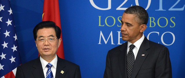 US President Barack Obama (R) looks at Chinese President Hu Jintao as he speaks before a bilateral meeting at the convention center in Los Cabos, Mexico on June 19, 2012, on the sidelines of the G20 summit. World leaders and the IMF tried to inject fresh confidence into the flagging global economy at the G20 summit, dominated by Europe's growth-sapping debt crisis. AFP PHOTO/Jewel Samad (Photo credit should read JEWEL SAMAD/AFP/GettyImages)