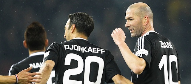 French former football player Zinedine Zidane (R) and French former football player Youri Djorkaeff of the team Ronaldo, Zidane and Friends celebrate during the gala football 'Match Against Poverty' organized by the United Nations Development Program (UNDP) on March 4, 2014 in Bern. AFP PHOTO / MICHAEL BUHOLZER