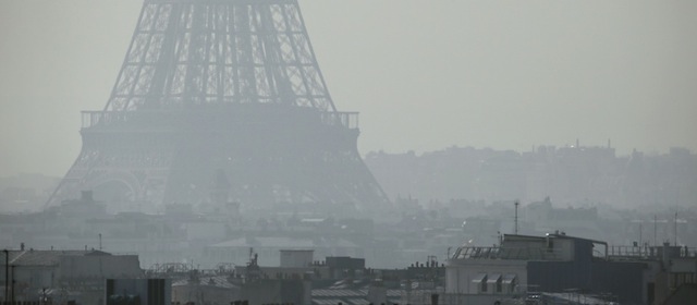 A view of the Eiffel Tower seen through thick smog, on March 14, 2014, in Paris. Fine particle pollution in several French cities continued unabated today as the modest measures taken by local authorities failed to solve the underlying problem. French non-governmental organization (NGO) Ecologie Sans Frontiere (Ecology without borders) confirmed on March 11 that they had filed a criminal complaint in Paris to denounce the "health scandal" of air pollution, as several regions of France experienced high levels of particulate pollution. AFP PHOTO / PATRICK KOVARIK (Photo credit should read PATRICK KOVARIK/AFP/Getty Images)