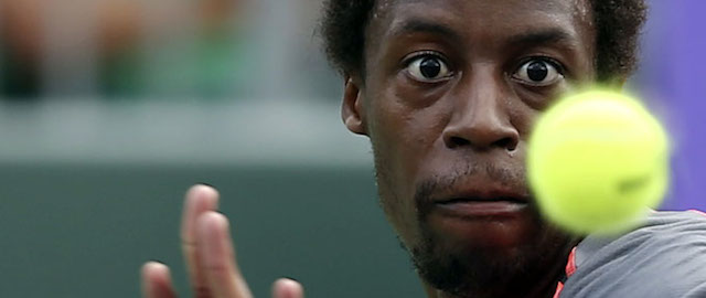 Gael Monfils, of France, keeps his eyes on the ball before hitting to Guillermo Garcia-Lopez during a match at the Sony Open Tennis in Key Biscayne, Fla., Saturday, March 22, 2014. (AP Photo/J Pat Carter)