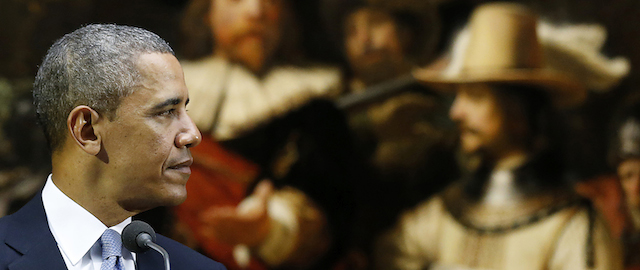 U.S. President Barack Obama delivers a statement in front of Dutch master Rembrandt's The Night Watch painting during a visit to the Rijksmuseum in Amsterdam, Netherlands, Monday, March 24, 2014. Obama will attend the two-day Nuclear Security Summit in The Hague. (AP Photo/Frank Augstein)