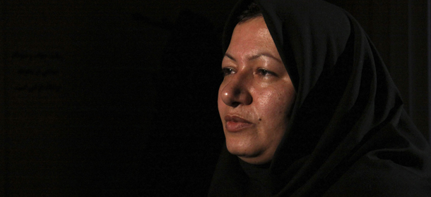 In this photo released by state-run Press TV, Sakineh Mohammadi Ashtiani, sentenced to death by stoning for adultery, sits for an interview with Press TV in Tabriz, Iran, Sunday, Dec. 5, 2010. The 43-year-old mother of two was brought from the prison to her home in northwestern Iran to "produce a visual recount of the crime at the murder scene," Press TV announced, denying reports that she had been released. (AP Photo/Press TV) EDS NOTE: THE ASSOCIATED PRESS HAS NO WAY OF INDEPENDENTLY VERIFYING THE CONTENT, LOCATION OR DATE OF THIS IMAGE.
