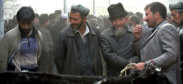 China-Xinjiang-unrest-Tiananmen,FOCUS by Carol Huang
This picture taken on November 7, 2013 shows Uighur men gathering at a bazaar to sell their live sheeps in Hotan, farwest China's Xinjiang region. The Muslim Uighurs of Hotan, according to Chinese authorities the home town of attackers who drove a car into crowds in Tiananmen square, say violence is driven not by global jihadism but a litany of police brutality, official discrimination and cultural repression. AFP PHOTO/CAROL HUANG (Photo credit should read CAROL HUANG/AFP/Getty Images)
