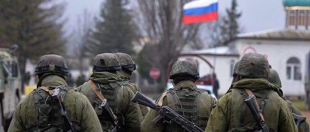 Russian soldiers patrol the area surrounding the Ukrainian military unit in Perevalnoye, outside Simferopol, on March 20, 2014. Kiev will never recognise Russia's annexation of Crimea and will fight for the "liberation" of the strategic Black Sea peninsula, Ukraine's parliament said in a resolution adopted on March 20. AFP PHOTO/ Filippo MONTEFORTE (Photo credit should read FILIPPO MONTEFORTE/AFP/Getty Images)