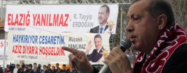 In this photo taken Thursday, March 6, 2014, Turkish Prime Minister Recep Tayyip Erdogan addresses a rally of his Justice and Development Party in Elazig, Turkey. Erdogan has threatened drastic steps to censor the Internet, including shutting down Facebook and YouTube, where audio recordings of his alleged conversations suggesting corruption have been leaked in the past weeks, dealing him a major blow ahead of this month's local elections.(AP Photo/Burhan Ozbilici) .