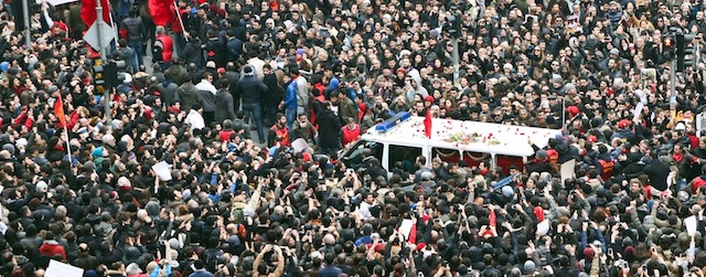 Thousands of people attend the funeral of Berkin Elvan, the 15-year-old boy who died from injuries suffered during last year's anti-government protests, in Istanbul on March 12, 2014. Riot police fired tear gas and water cannon at protestors in the capital Ankara, while in Istbanbul, crowds shouting anti-government slogans lit a huge fire as they made their way to a cemetery for the burial of Berkin Elvan. AFP PHOTO / GURCAN OZTURK (Photo credit should read GURCAN OZTURK/AFP/Getty Images)