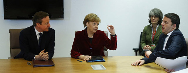 German Chancellor Angela Merkel, center, gestures while speaking with British Prime Minister David Cameron, left, and Italian Prime Minister Matteo Renzi, right, during a meeting on the sidelines of an EU summit in Brussels on Thursday, March 6, 2014. European Union leaders are holding an emergency summit to decide on imposing sanctions against Russia over its military incursion in Ukraine's Crimean peninsula. The EU leaders were gathering Thursday as the 28-nation bloc seeks to find the right response to the conflict unfolding just beyond its eastern border in Ukraine. (AP Photo/Yves Herman, Pool)