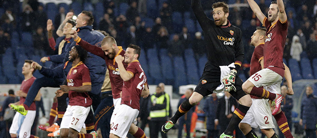 AS Roma players celebrate at the end of a Serie A soccer match between AS Roma and Torino, at Rome's Olympic Stadium, Tuesday, March 25, 2014. AS Roma won 2-1. (AP Photo/Andrew Medichini)