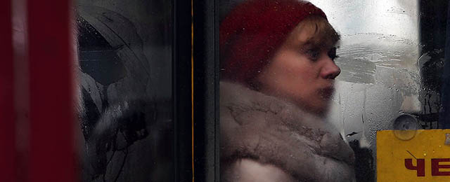 SIMFEROPOL, UKRAINE - MARCH 10: A woman is viewed on a public bus in the Crimean city of Simferopol as the work day begins on March 10, 2014 in Simferopol, Ukraine. As the standoff between the Russian military and Ukrainian forces continues in Ukraine's Crimean peninsula, world leaders are pushing for a diplomatic solution to the escalating situation. Crimean citizens will vote in a referendum on 16 March on whether to become part of the Russian federation. (Photo by Spencer Platt/Getty Images)