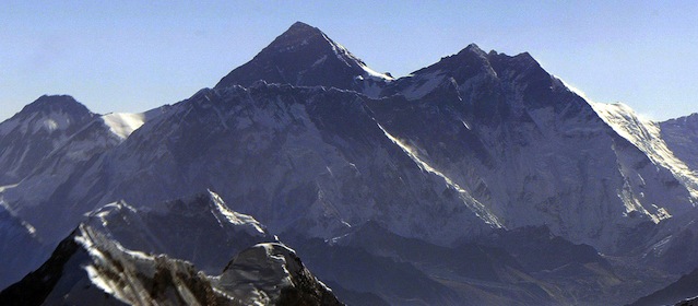 This picture dated 26 May 2003 shows an aerial view of the world's tallest 8,848 metre (29,028 feet) high Mt Everest (L). Nepal is celebrating the Golden Jubilee making the conquest of Mt Everest, where Sir Edmund Hillary along with Sherpa Tenzing Norgay were the first to scale the world's highest mountain, reaching the summit on 29 May 1953. AFP PHOTO/Kazuhiro NOGI (Photo credit should read KAZUHIRO NOGI/AFP/Getty Images)