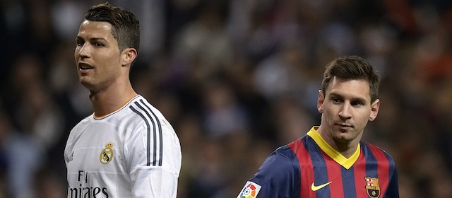 Barcelona's Argentinian forward Lionel Messi (R) stands past Real Madrid's Portuguese forward Cristiano Ronaldo during the "El clasico" Spanish League football match Real Madrid vs Barcelona at the Santiago Bernabeu stadium in Madrid on March 23, 2014. Barcelona won 4-3. AFP PHOTO/ DANI POZO (Photo credit should read DANI POZO/AFP/Getty Images)