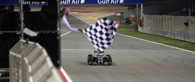 Mercedes AMG Petronas driver Lewis Hamilton crosses the finish line to win the Formula One Bahrain Grand Prix at Sakhir circuit in Manama on April 6, 2014. AFP PHOTO / PATRICK BAZ (Photo credit should read PATRICK BAZ/AFP/Getty Images)
