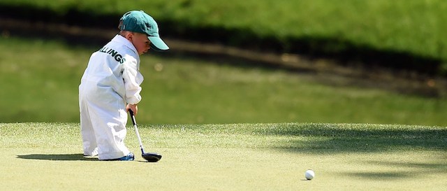 Finn, son of Scott Stallings of the US, plays during the Par 3 Contest prior the start of the 78th Masters Golf Tournament at Augusta National Golf Club on April 9, 2014 in Augusta, Georgia. Augusta National's trademark back-nine drama in the final round of the Masters could reach epic heights Sunday with a field that offers no clear favorite and several rising young stars. AFP PHOTO/Jim WATSON (Photo credit should read JIM WATSON/AFP/Getty Images)