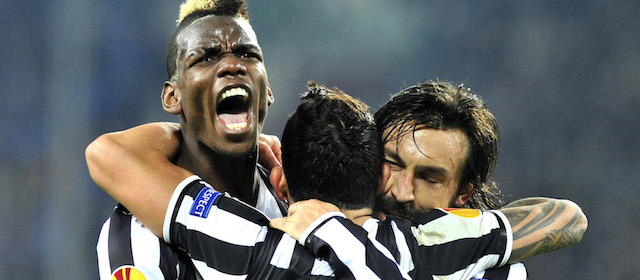 Juventus midfielder Paul Pogba, of France, celebrates after scoring with teammates Andrea Pirlo, right, and Carlos Tevez, center, during the Europa League, round of 16th, soccer match between Juventus and Trabzonspor at the Juventus stadium, in Turin, Italy, Thursday, Feb. 20, 2014. (AP Photo/Massimo Pinca)